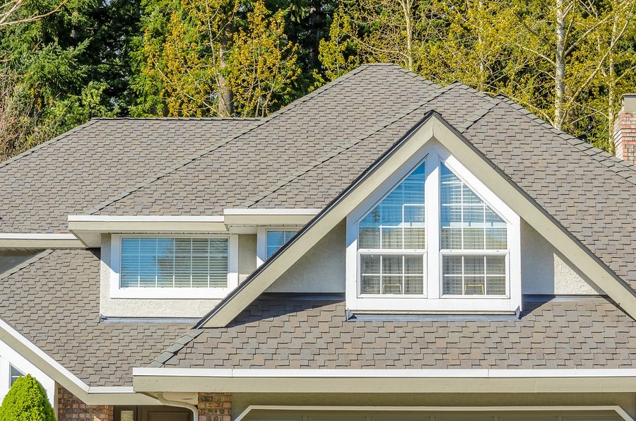 The roof of the house with nice window.