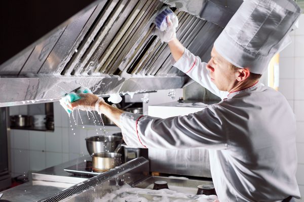 cleaning commercial kitchen wall